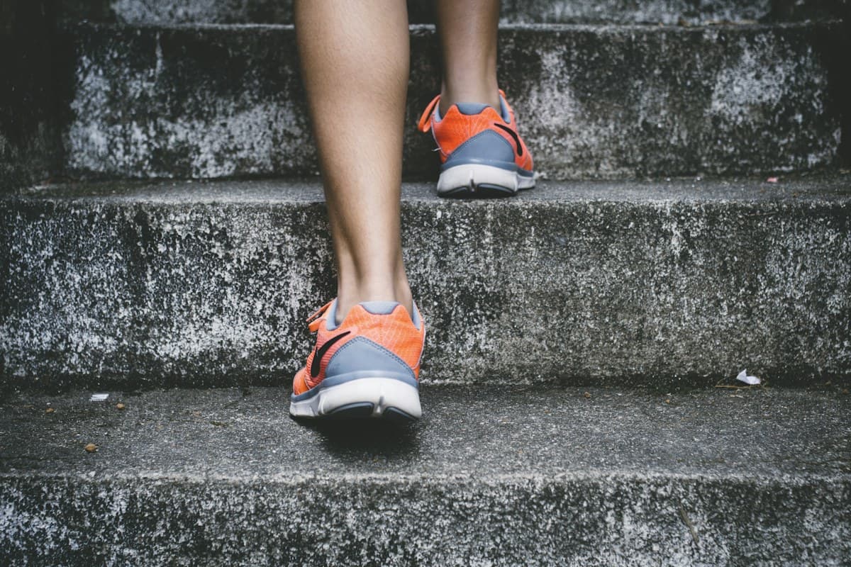 Runner climbing outdoor stone steps